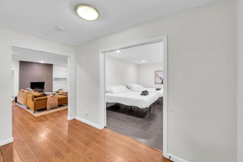 a bedroom with a bed and a living room at FIFA World Cup Backyard Retreat in Dallas