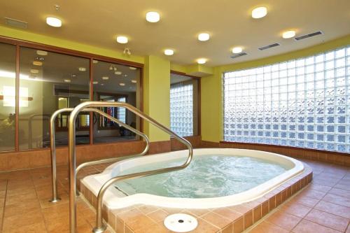 a jacuzzi tub in a room with a building at Whistler Blackcomb Vacation Rentals in Whistler