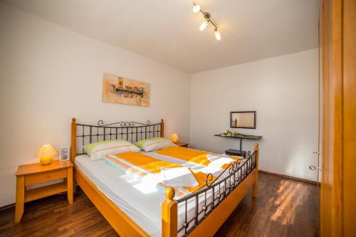 a bedroom with a large bed in a room at Apartments Kati in Omiš