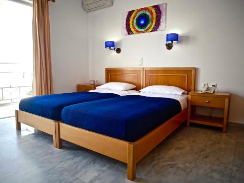 Ένα ή περισσότερα κρεβάτια σε δωμάτιο στο Kanakis Blue Beach Apartments