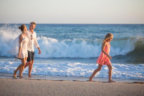 a group of people walking on the beach at Barceló Cabo de Gata in Retamar