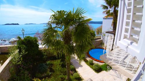 a view of the ocean from the balcony of a building at Villa Agnes in Orebić