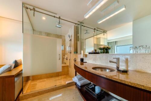 a bathroom with a sink and a shower at Hyatt Regency Trinidad in Port-of-Spain