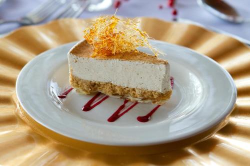 a piece of cake on a plate on a table at Umzolozolo Private Safari Lodge & Spa in Nambiti Private Game Reserve