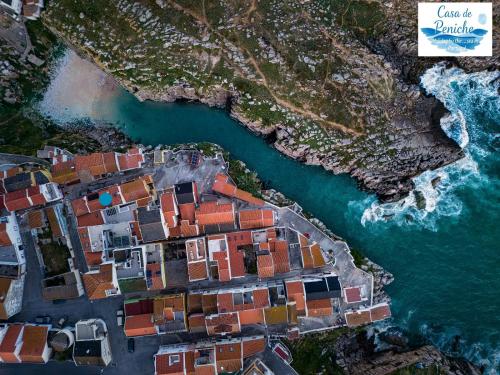 an aerial view of a village next to the water at Casa de Peniche in Peniche