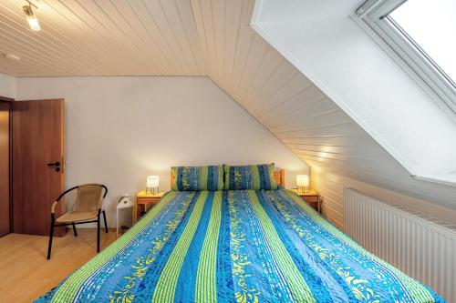 a bedroom with a bed in a attic at Am Fabianstift 1 in Hornbach