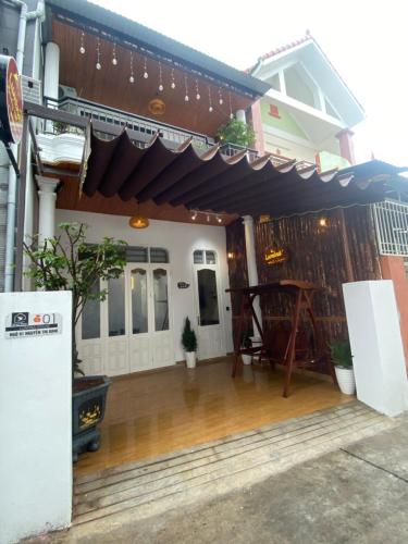 a patio of a house with awning on it at Homestay Lumina in Dong Hoi