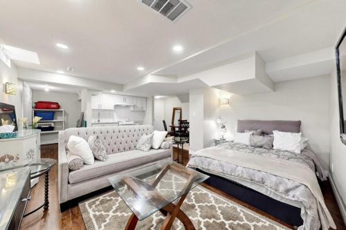 a living room with two beds and a couch at The Boxwood Executive Suite in Markham
