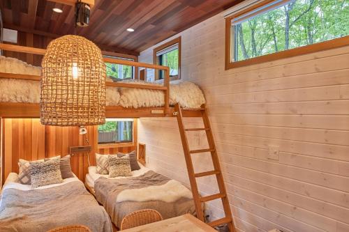 a room with two bunk beds and a chandelier at TinyCabinTATEGU#01 - Vacation STAY 04108v in Miyota