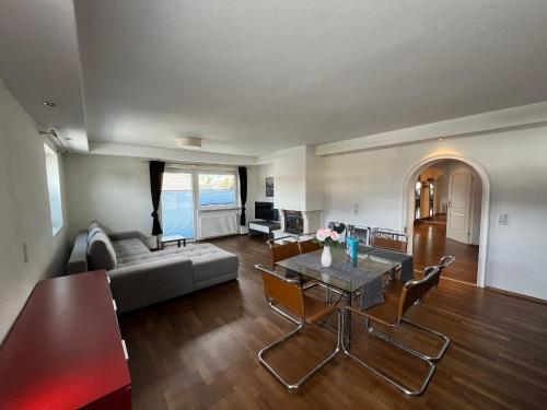 a living room with a couch and a table at chapter-one in Innsbruck