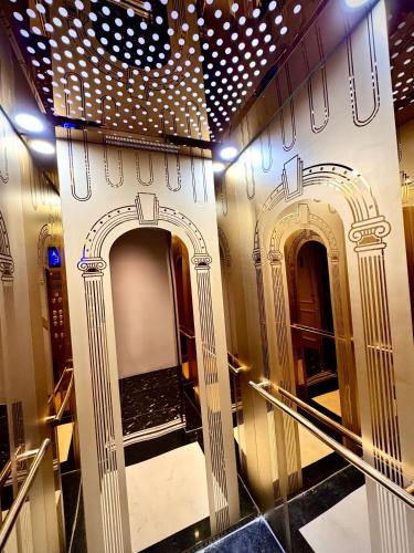 a hallway with two archways in a building at EuroDana Palace Hotel in Danang