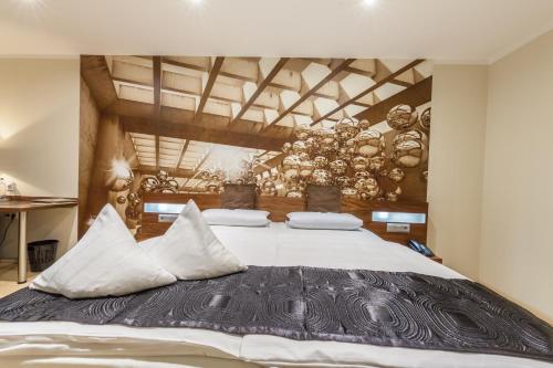 Кровать или кровати в номере Akzent Hotel Tietmeyer