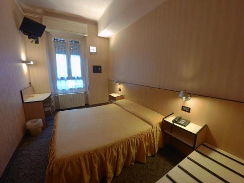 Postel nebo postele na pokoji v ubytování Hotel Ada