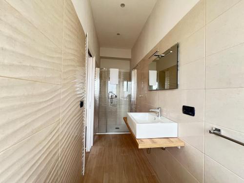 a bathroom with a white sink and a shower at Blue Diamond in Vibo Valentia Marina
