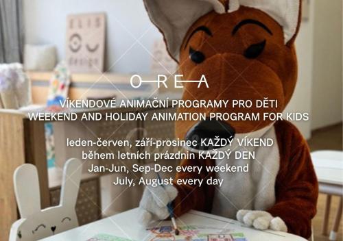 a stuffed animal is sitting at a table at OREA Resort Santon Brno in Brno