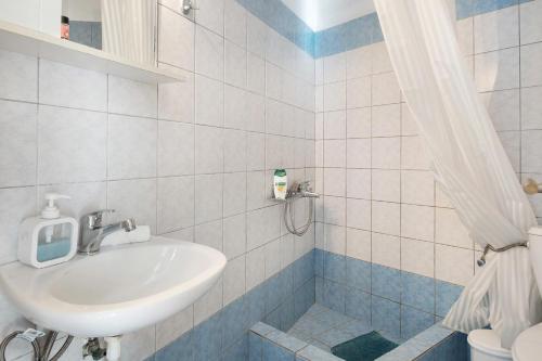 a bathroom with a sink and a toilet at Merichas 7 Irida in Mérikhas