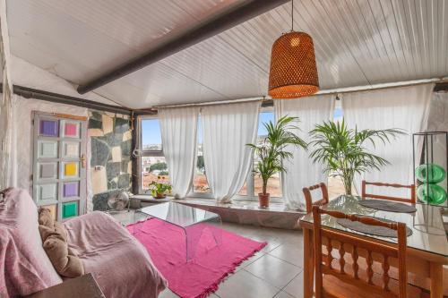 a living room with a table and a couch at Oaxaca Venado in Agaete