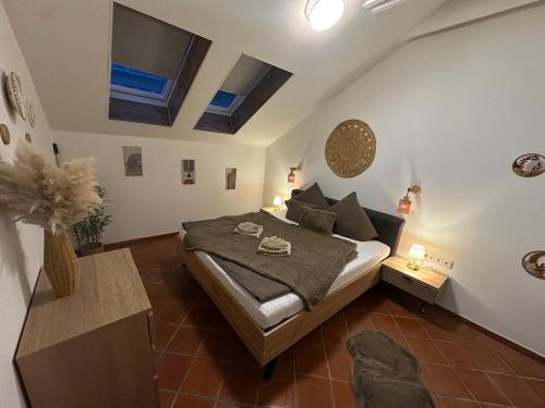 a bedroom with a large bed in a room at Honor-Penthouse in Linz