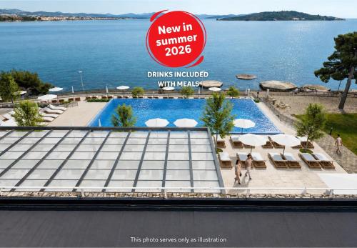 a sign for a new swimming pool at a resort at Hotel Punta in Vodice