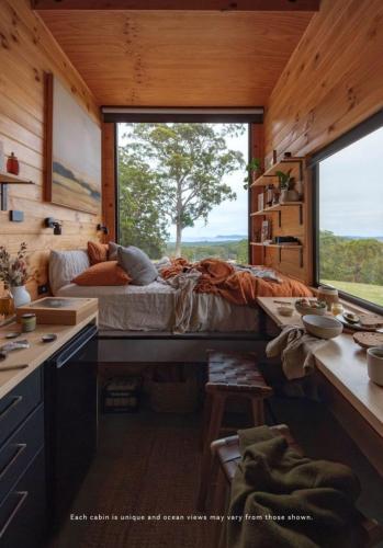a bedroom with a bed and a large window at Heyscape Denmark in Denmark
