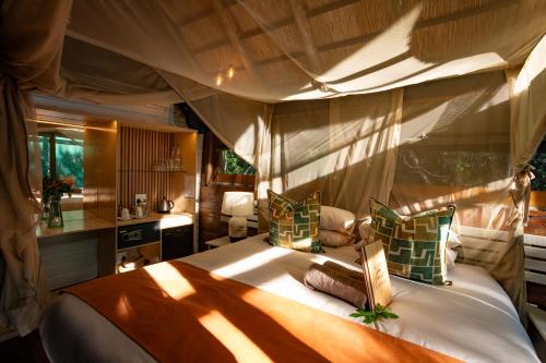 a bedroom with a large bed in a room at Kosi Forest Lodge in Manguzi