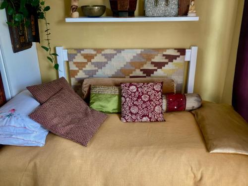 a bed with pillows on top of it at Eagles Nest in Kirstenhof