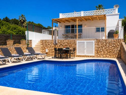 Foto Hermosa casa con piscina cerca de la playa de Punta Prima 1