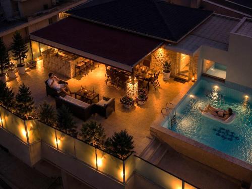 an overhead view of a swimming pool with lights at Luxury Penthouse with private pool in Preveza