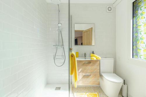 a bathroom with a shower with a toilet and a sink at Studio La Provençale in Avignon