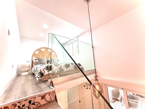 a room with a bed and a mirror at Jazmin 6 ( whole apartment ) in Alicante