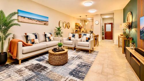 a large living room with couches and a table at 2 at Sunset View in Langstrand