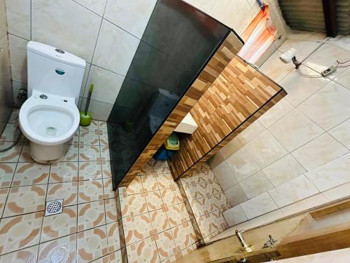 an overhead view of a bathroom with a toilet at Sagada Pinewood Lodge basement in Sagada
