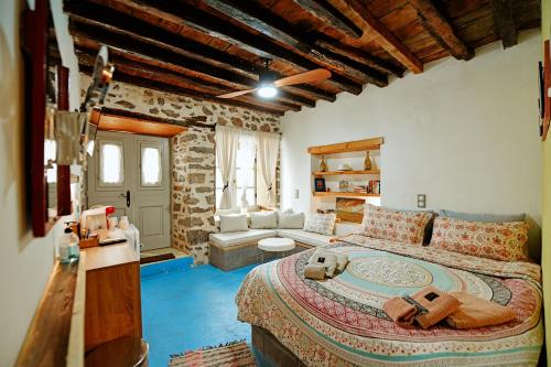 a bedroom with a large bed in a room at Mastoris Mansion in Hydra