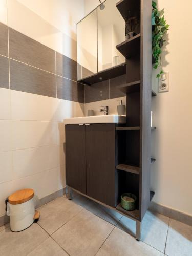 a bathroom with a sink and a toilet at Le Pont Ravet in Bernay