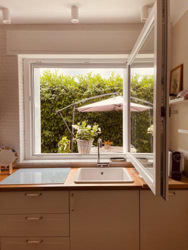 a kitchen with a sink and a window at Ca del Gno in Luni