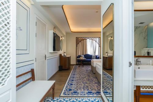 a hotel room with a bathroom and a sink at Bhagirathi By Atishay in Haridwār