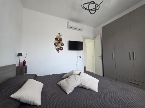 a bedroom with a bed with two pillows on it at Fiumicino Beach - Sleep & Fly in Focene