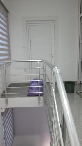 a bunk bed with purple towels on it in a room at air&wizz II in Dubrave Gornje
