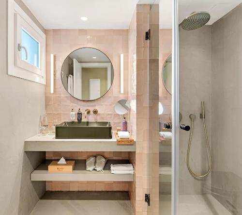 a bathroom with a green sink and a shower at Boho Club Marbella - a Preferred Hotel in Marbella