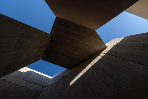 a view of the sky from the bottom of a building at Elysium Caved Villas - Carved From Calm by etouri in Heraklio