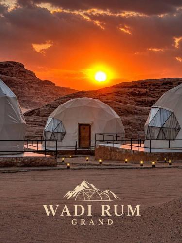 a sunset over the wadi rum grandstand with two domes at WADI RuM GRAND in Wadi Rum