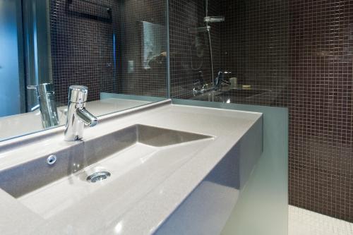 a bathroom with a sink and a mirror at Skistar Lodge Trysil in Trysil
