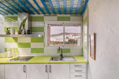a kitchen with a sink and a window at Oaxaca Puma in Agaete
