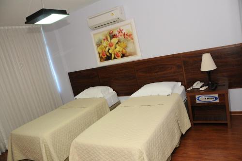 Katil atau katil-katil dalam bilik di Gallant Hotel