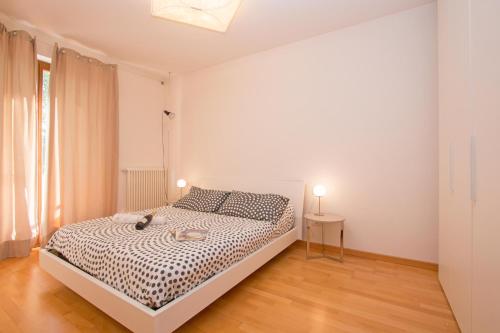 Posteľ alebo postele v izbe v ubytovaní Benacus E4 Apartment by Wonderful Italy