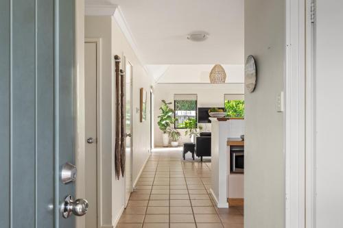 a hallway leading to a kitchen and a living room at Villa 11 Margaret River Beach House in Margaret River Town