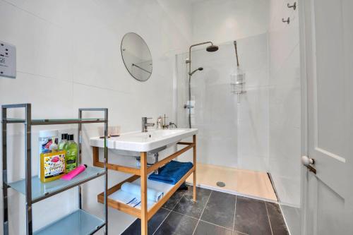 a bathroom with a sink and a shower at Finest Retreats - The Pottage in Yaxley