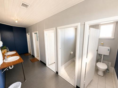 a bathroom with a toilet and a sink at Geraldton Shoreline Lodge in Geraldton