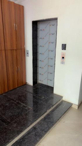 an empty room with a closet and a door at Hotel Aura Avenue in Bathinda
