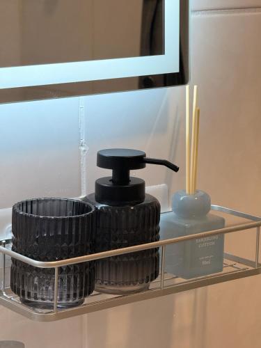 a stack of plates on a shelf in a bathroom at Uferglanz - Balcony, view, sparkling wine, snacks in Koblenz